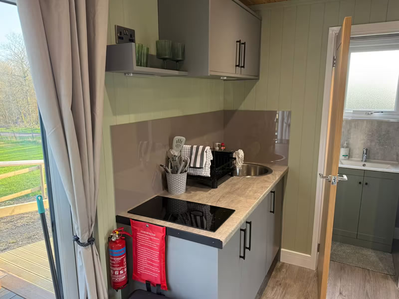 Kitchen inside Brynhyfryd Farm shepherd's hut