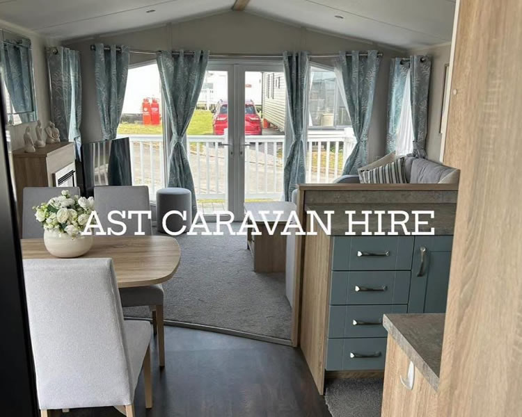 Spacious open-plan lounge inside Poplars Caravan