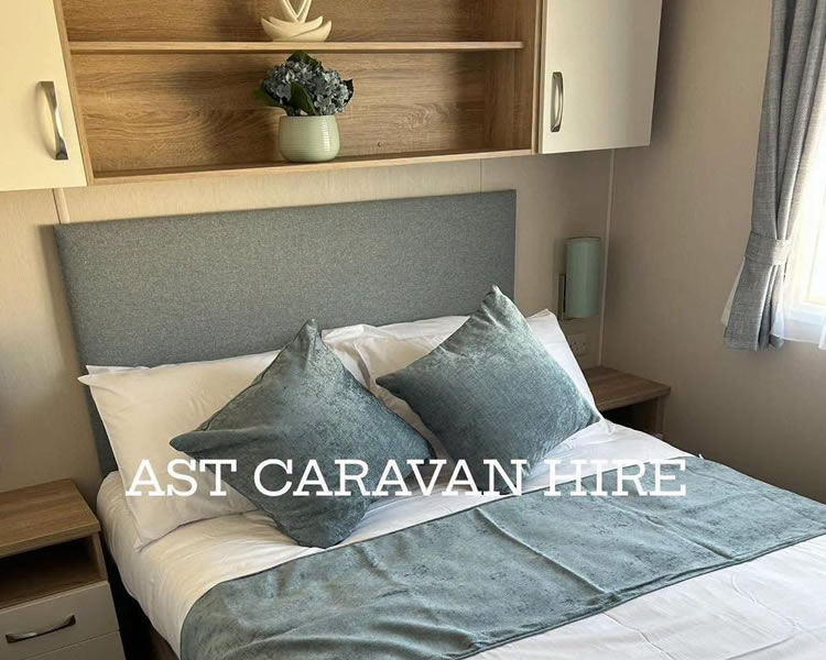 Master bedroom inside Poplars Caravan at Trecco Bay
