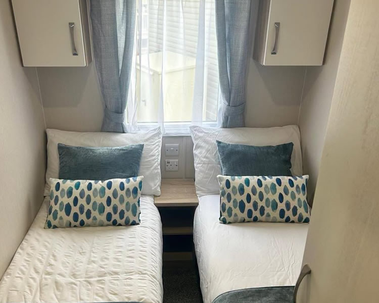 Twin bedroom inside Poplars Caravan
