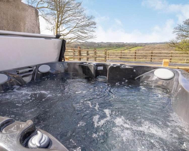 Private hot tub overlooking the countryside at The Welsh Barn