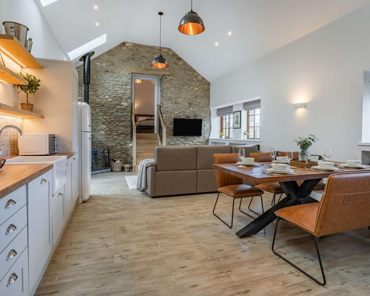 Open-plan living and dining area at The Welsh Barn