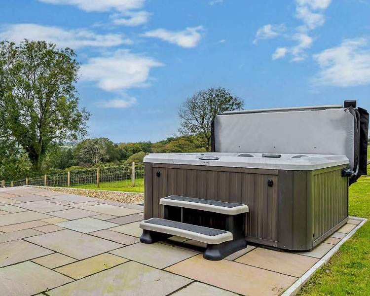 Private hot tub overlooking the countryside at Y Beudy